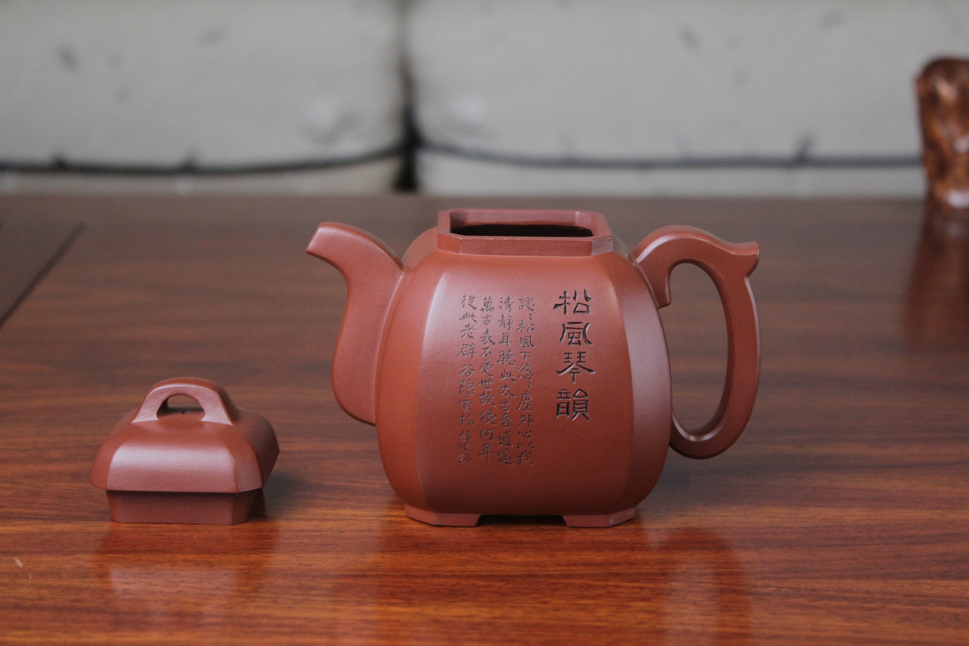 detail of the collectible teapot from teapot artist on the table