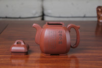 detail of the collectible teapot from teapot artist on the table