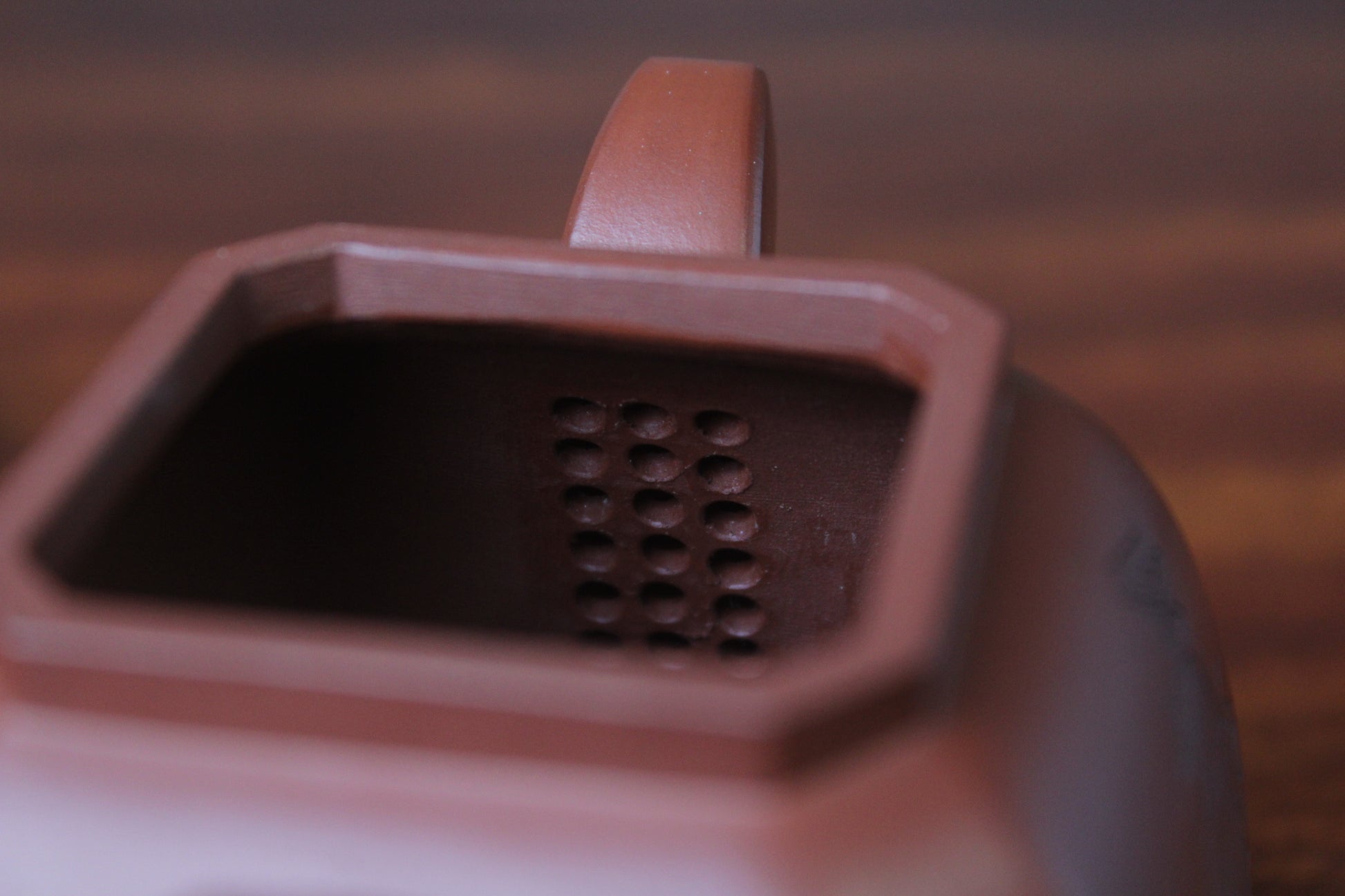 filter of the collectible teapot from teapot artist on the table