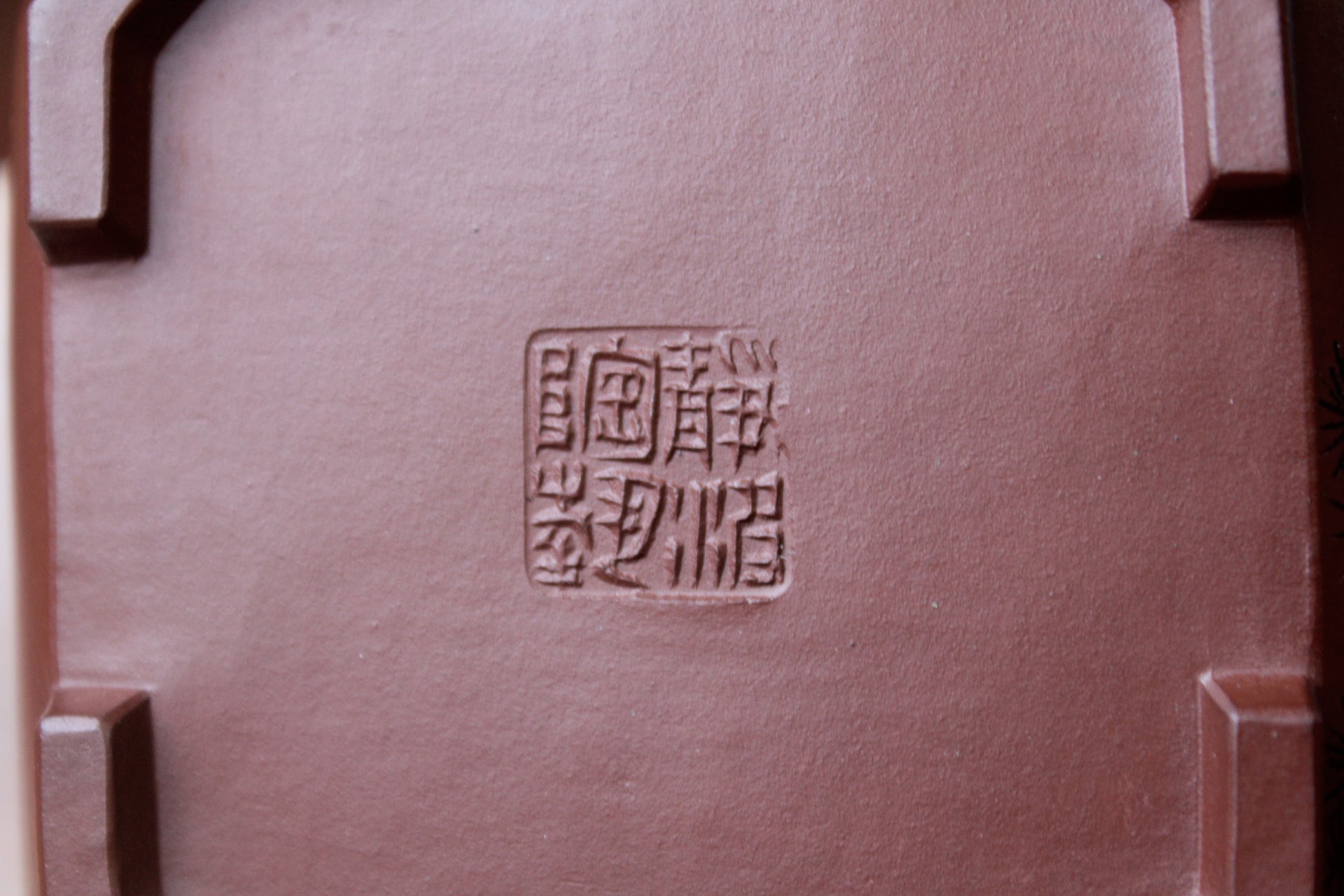 mark of the collectible teapot from teapot artist on the table