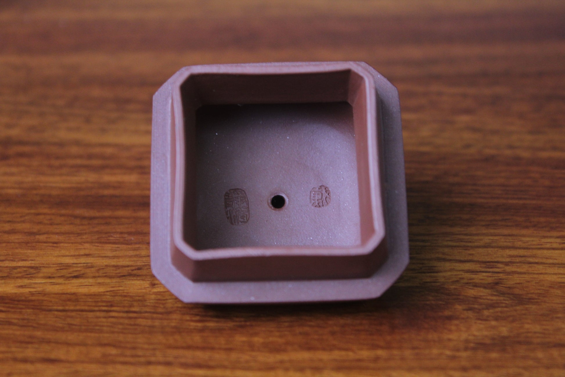 lid of the collectible teapot from teapot artist on the table