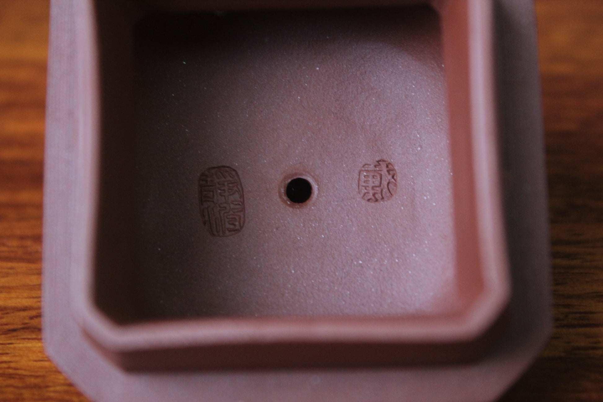 lid marks of the collectible teapot from teapot artist on the table