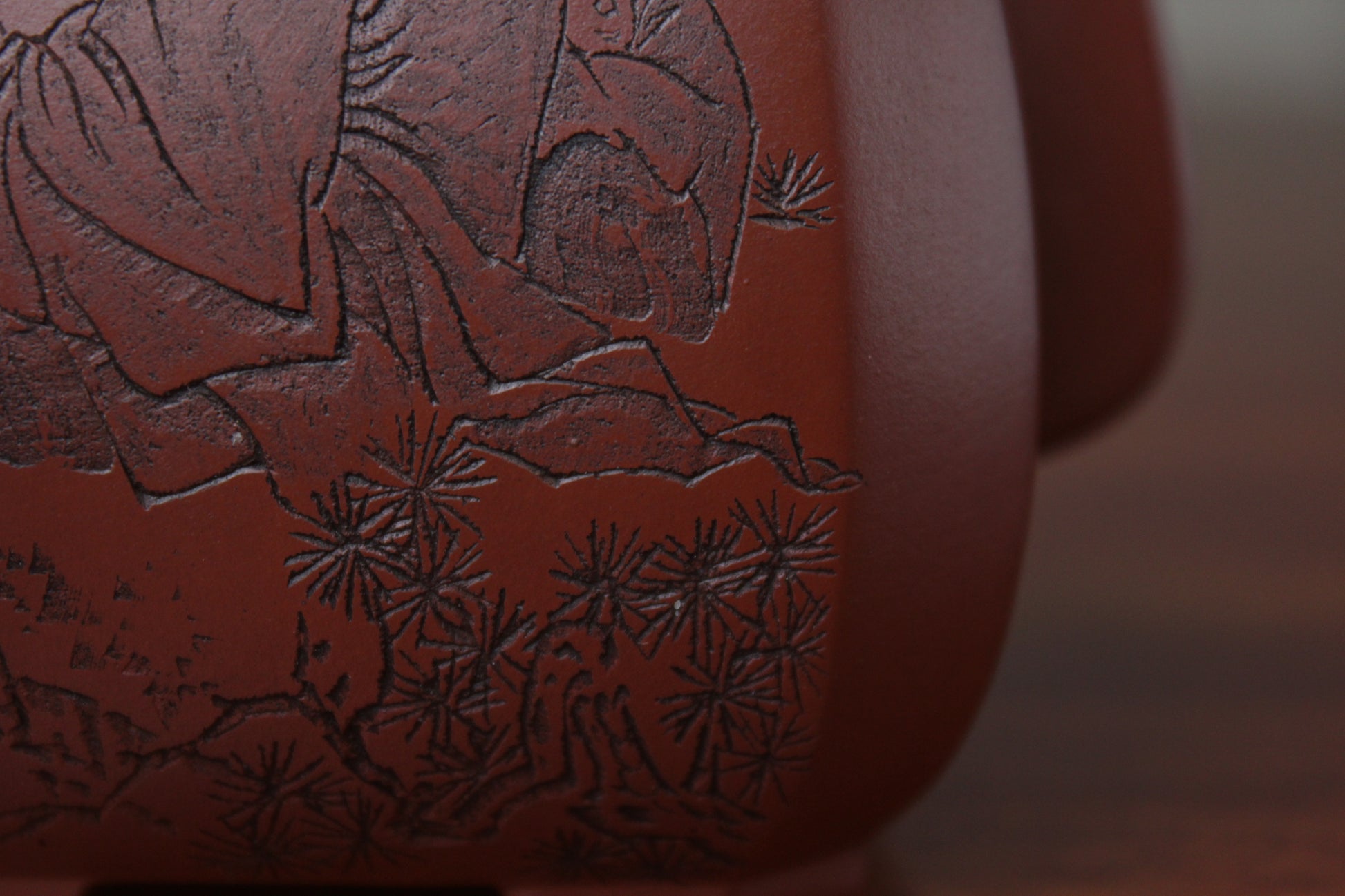 detail of the collectible teapot from teapot artist on the table