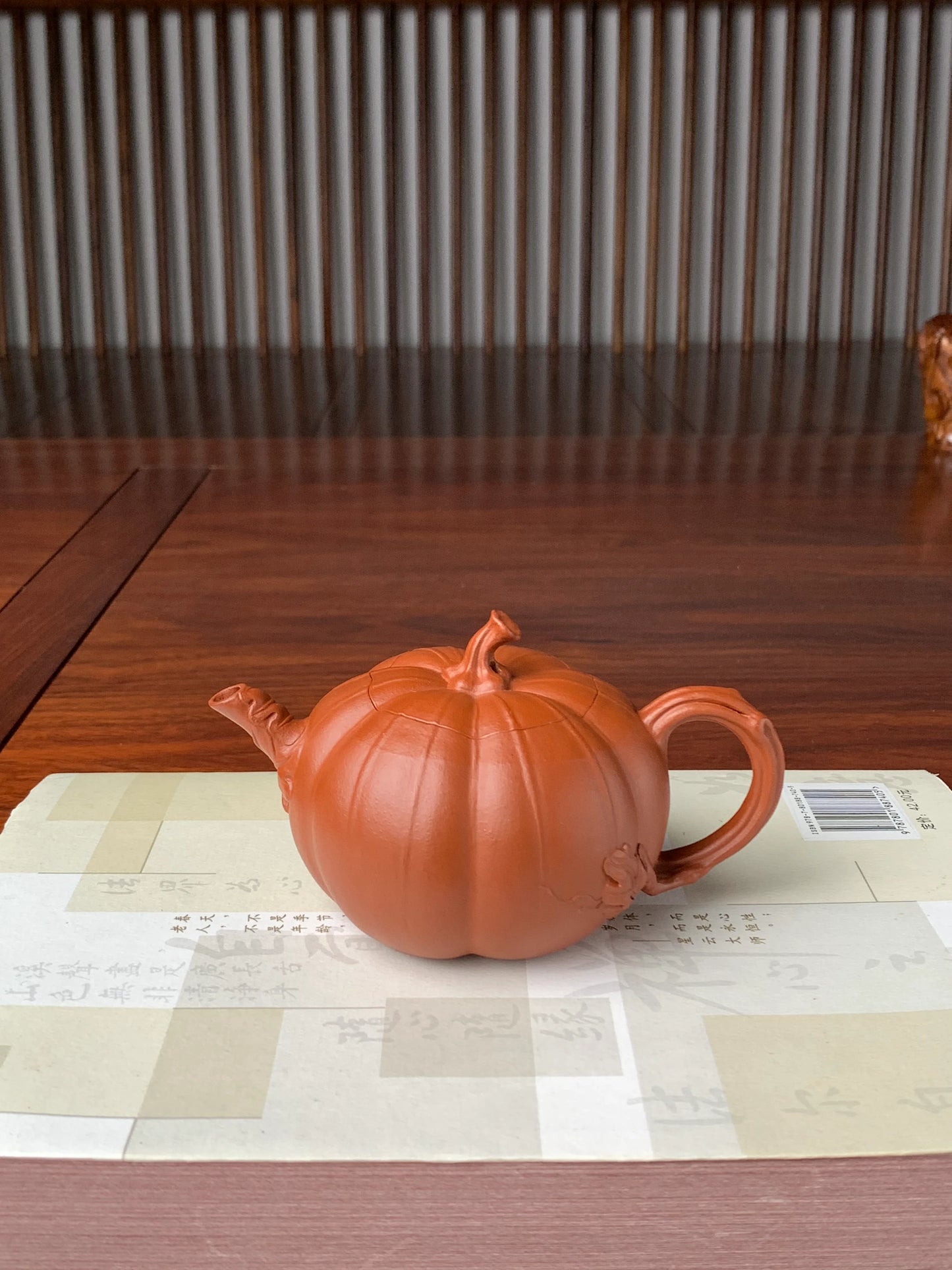 collectible teapot named pumpkin on the table