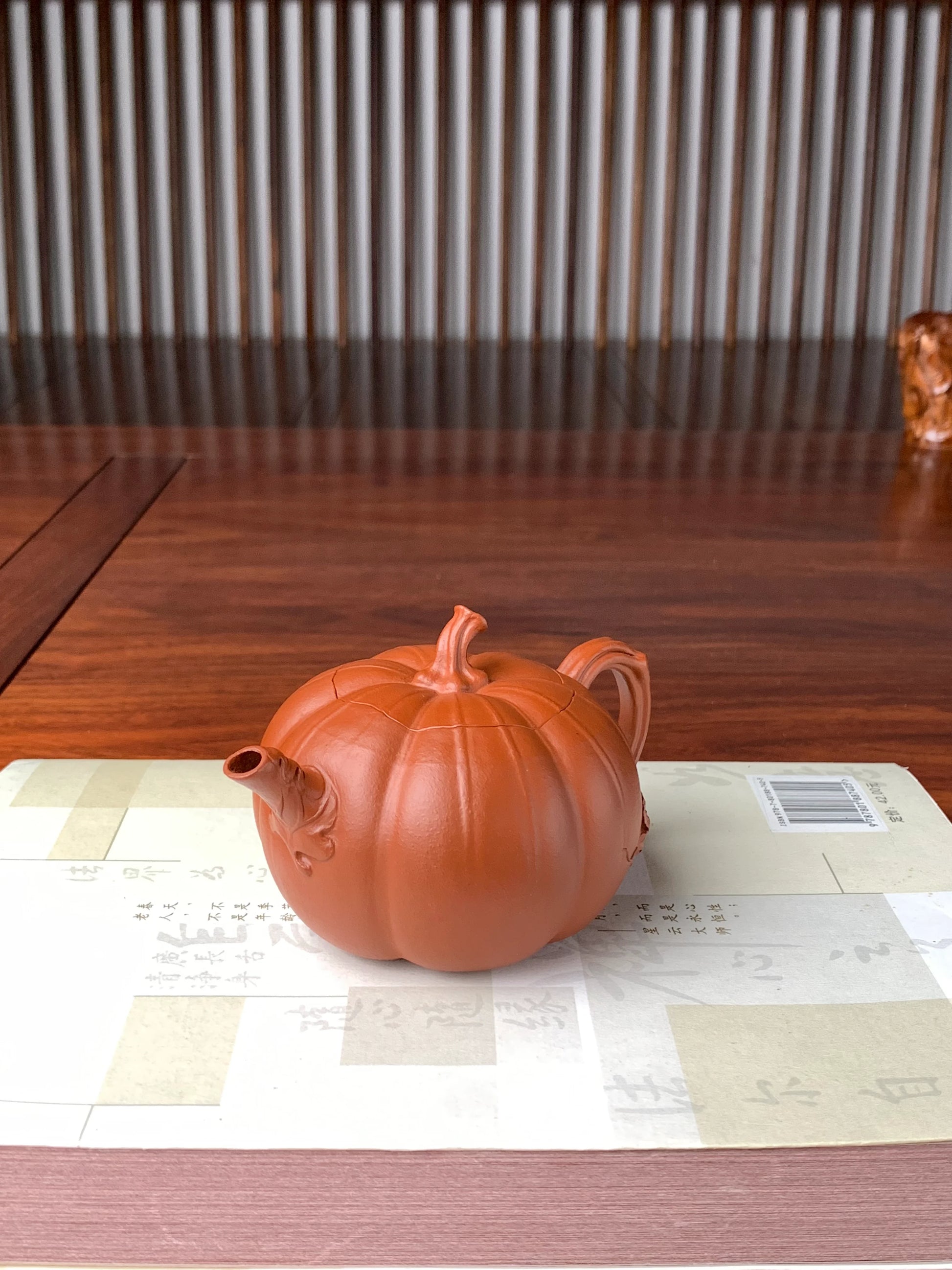 right view of the collectible teapot named pumpkin on the table