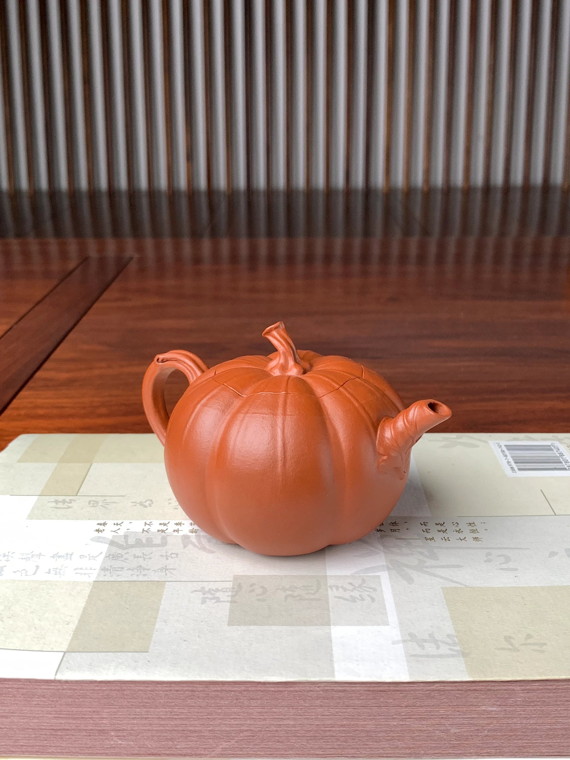 right view of the collectible teapot named pumpkin on the table