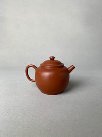 collectible teapot named ju lunzhu handmade with red clay