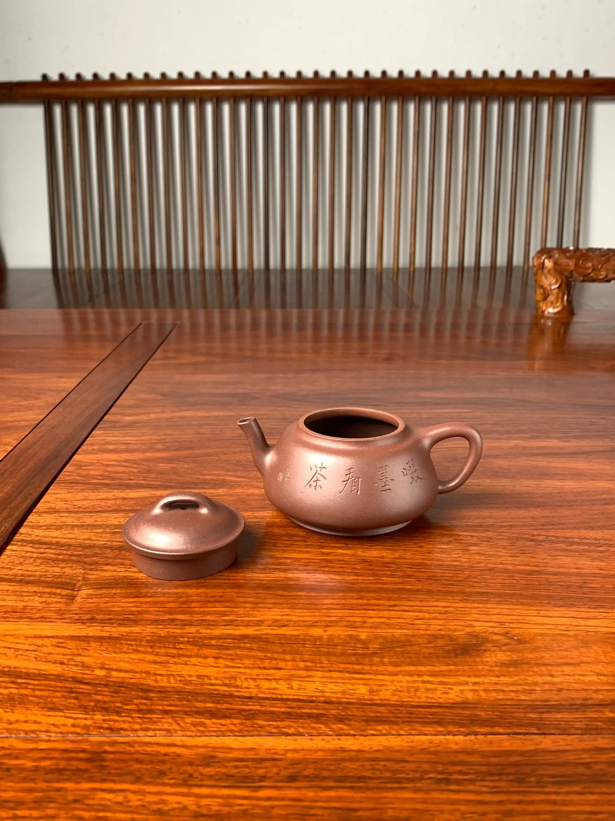 the lid and the teapot body on the table