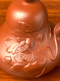 Close-up view of the hand-sculpted lotus details