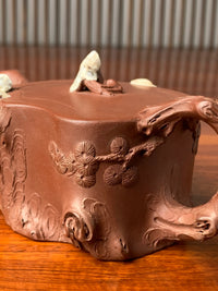 Decorated pine branches on the collectible teapot