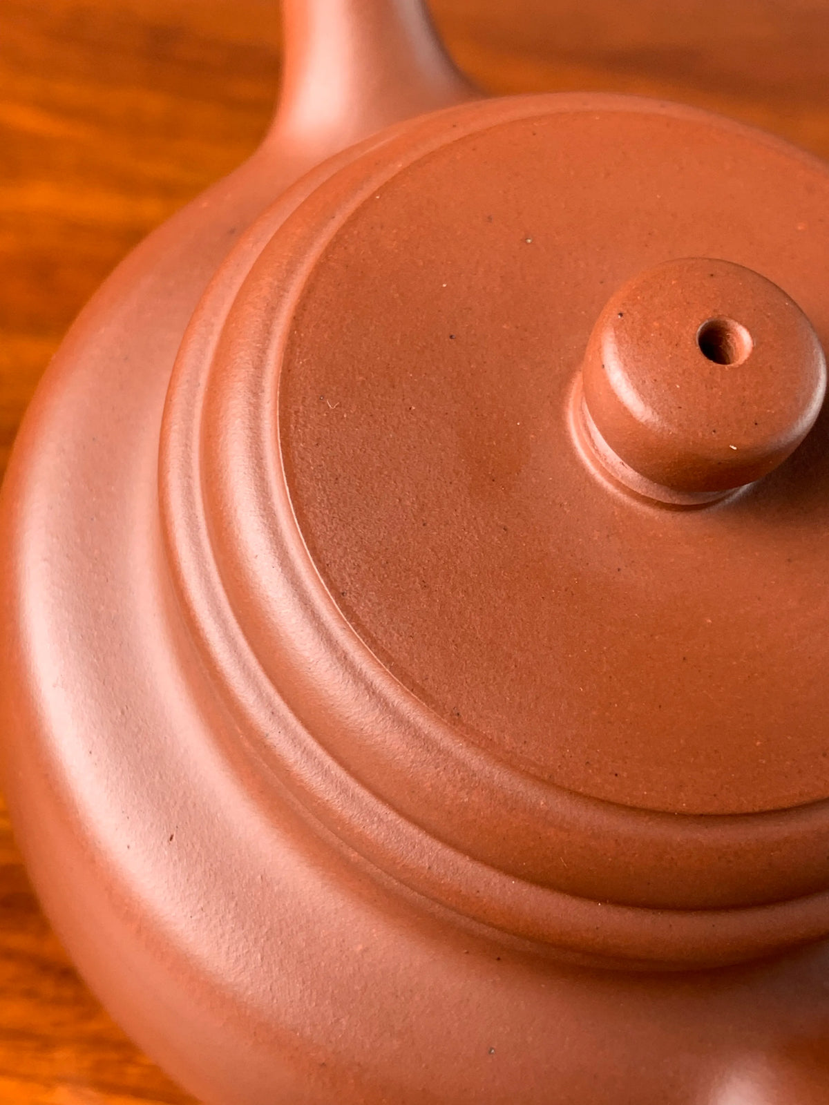 The lid details of a collectible teapot with a minimalist design style