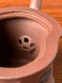 the ball filter of the beautiful teapot named pine tree