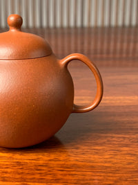 the handle of the small yixing teapot 