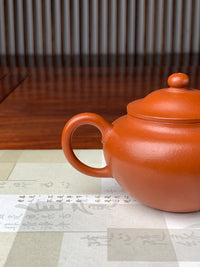 View the teapot’s handle from another angle.