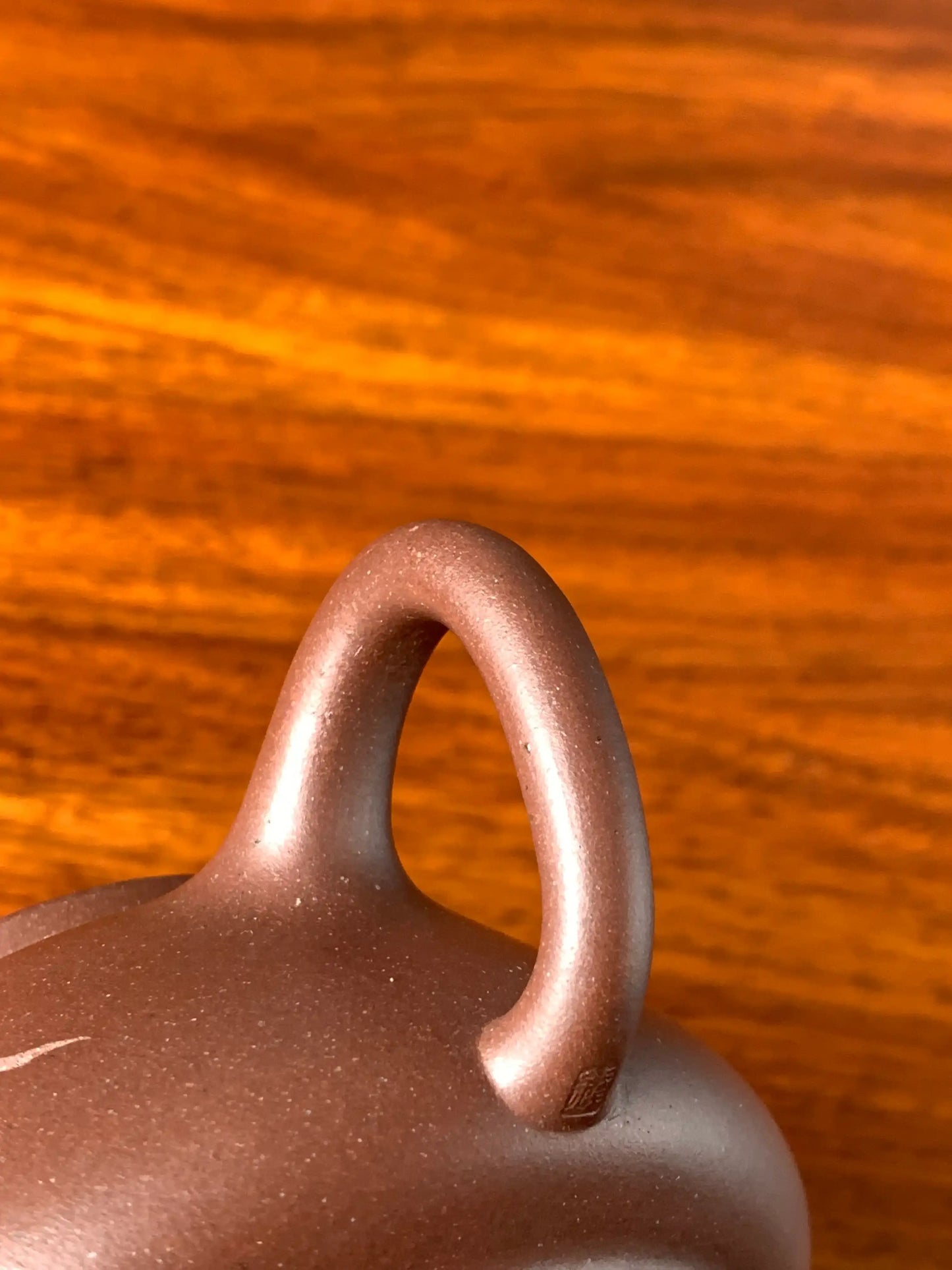 the handle of the collectible teapot named wu piao