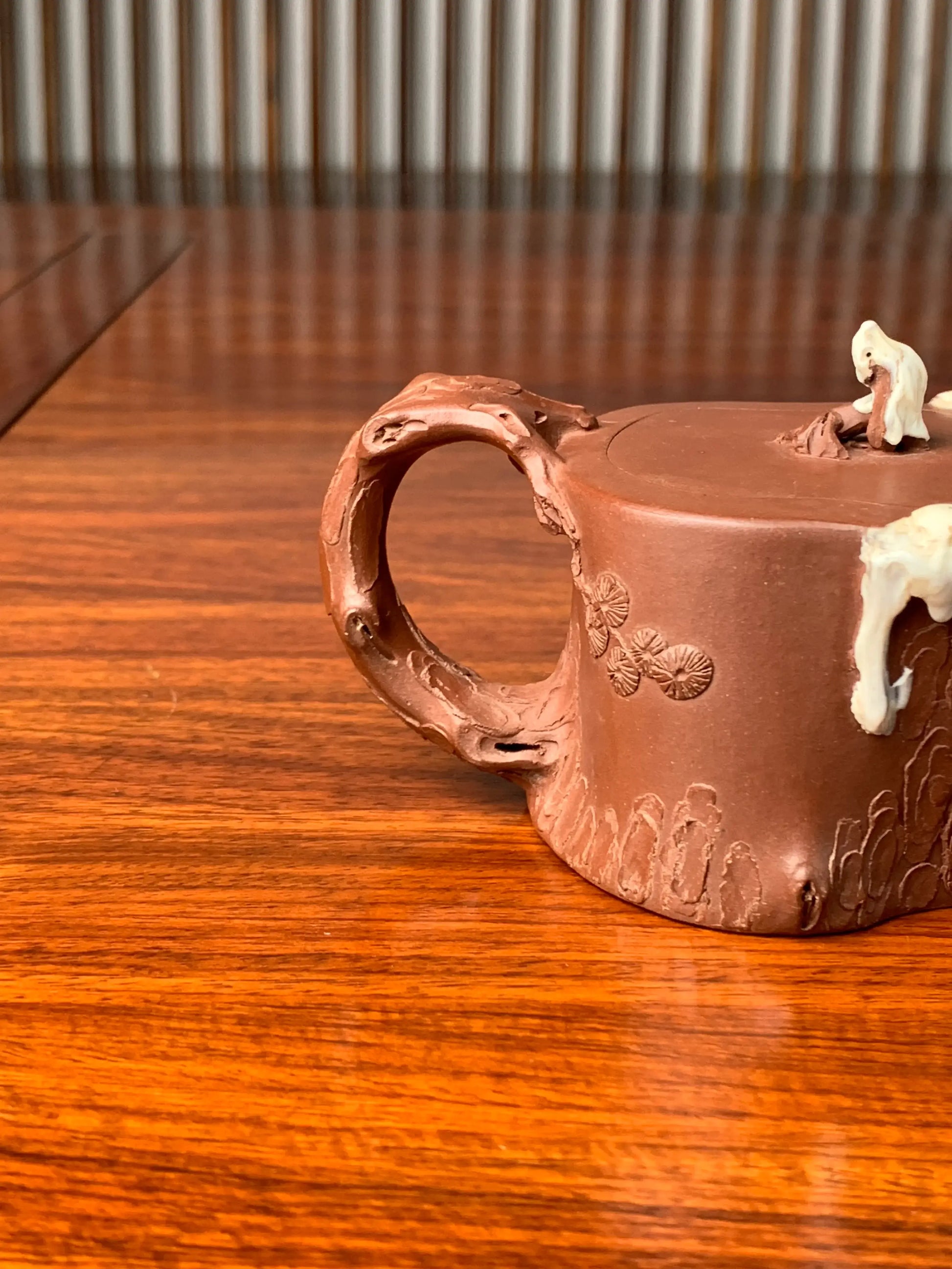 collectible teapot with branch-shaped handle