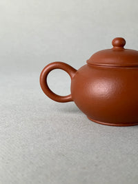 the handle of the small yixing teapot 