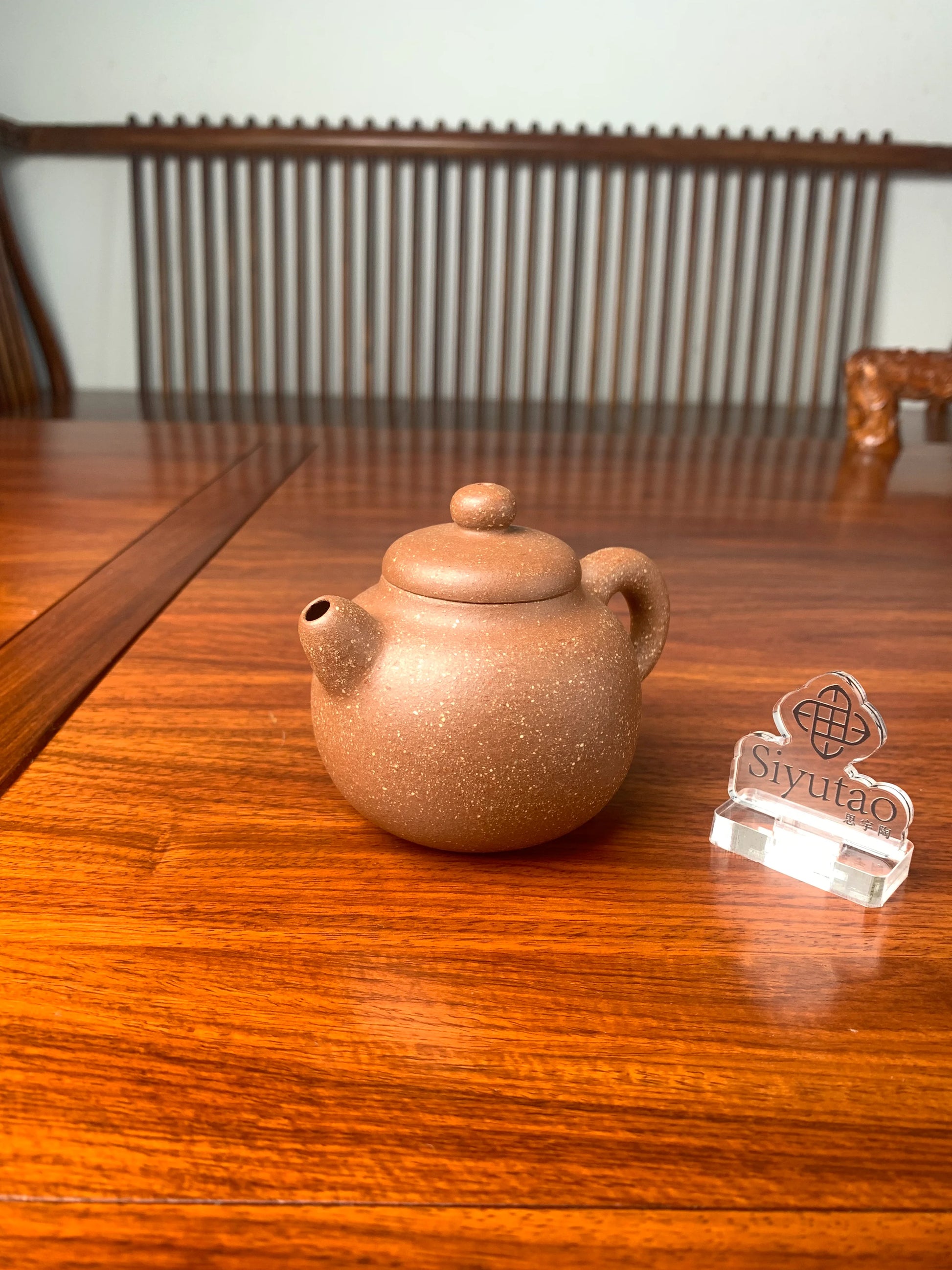 the right view of the handmade yixing teapot on the table
