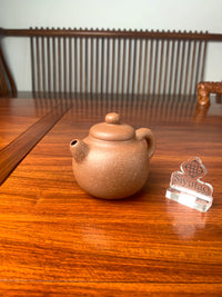 the right view of the handmade yixing teapot on the table