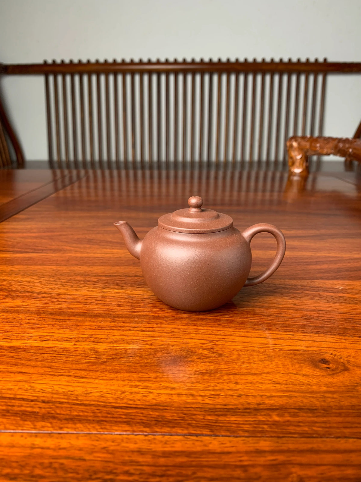 handmade yixing teapot named ping gai lian zi on the table