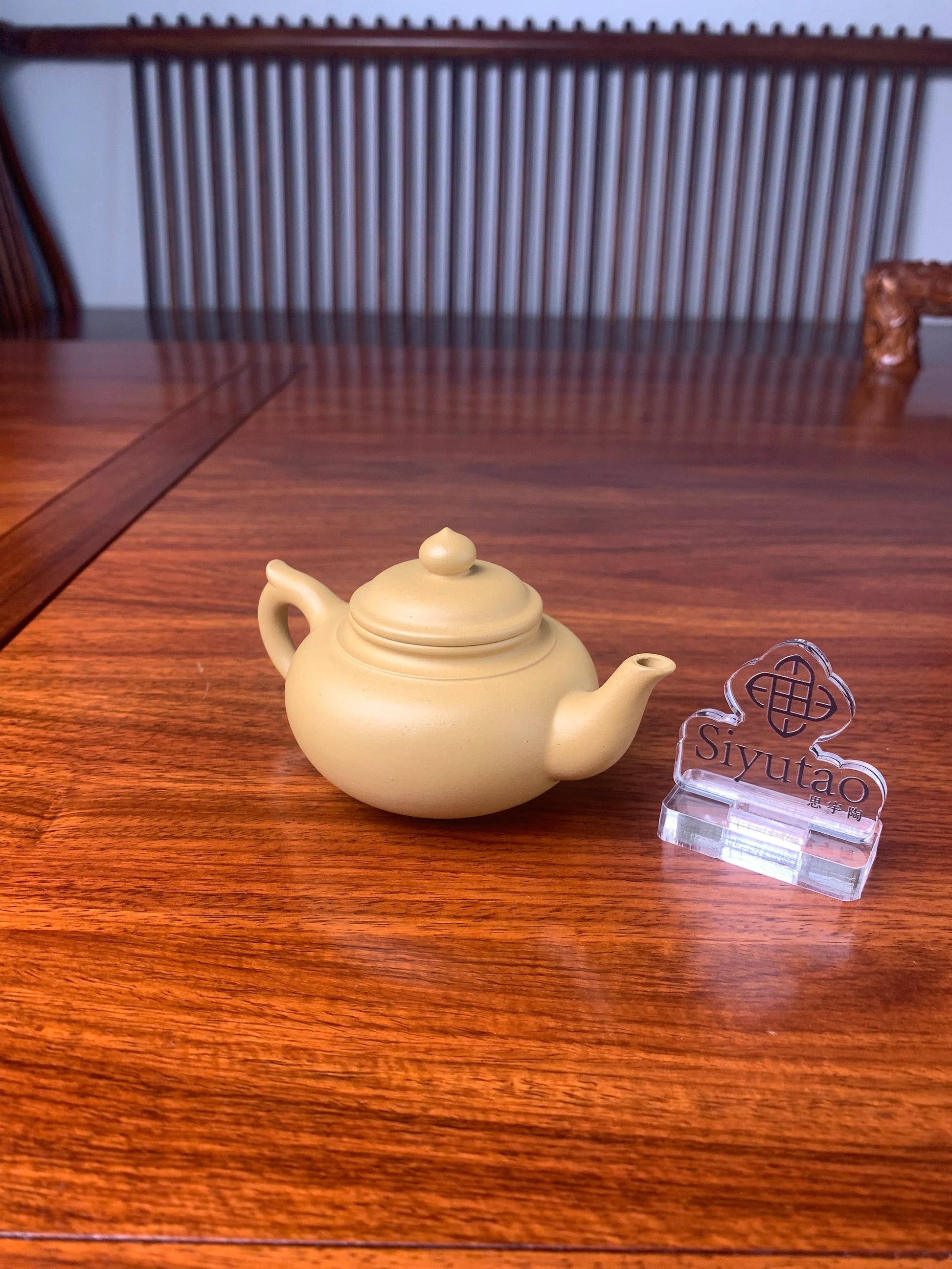 handmade yixing teapot named xiao ying left view