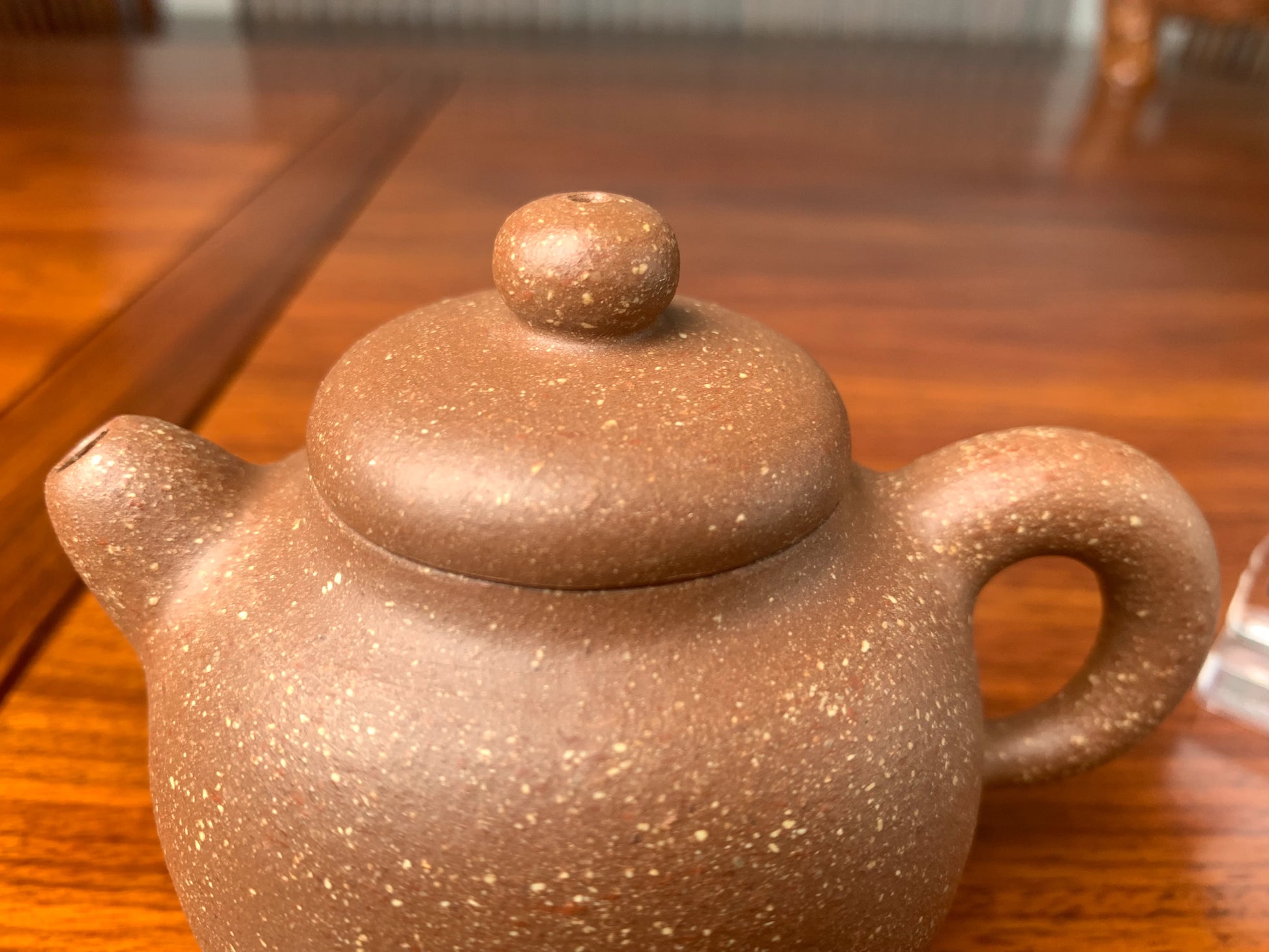 the details of handmade yixing teapot on the table