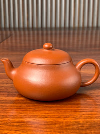 A close up photo of the body of this teapot