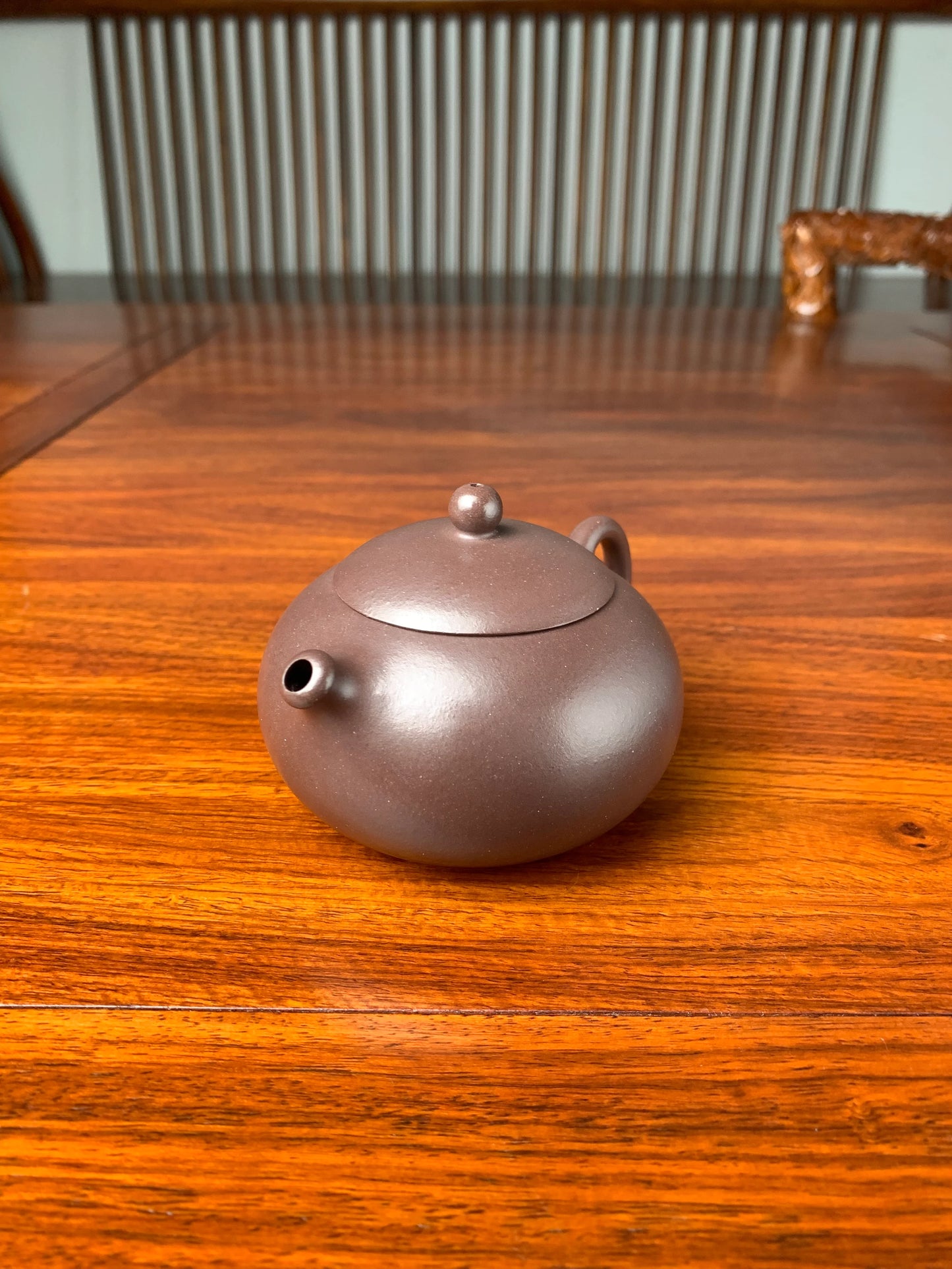 the side view of the handmade yixing teapot named xi shi