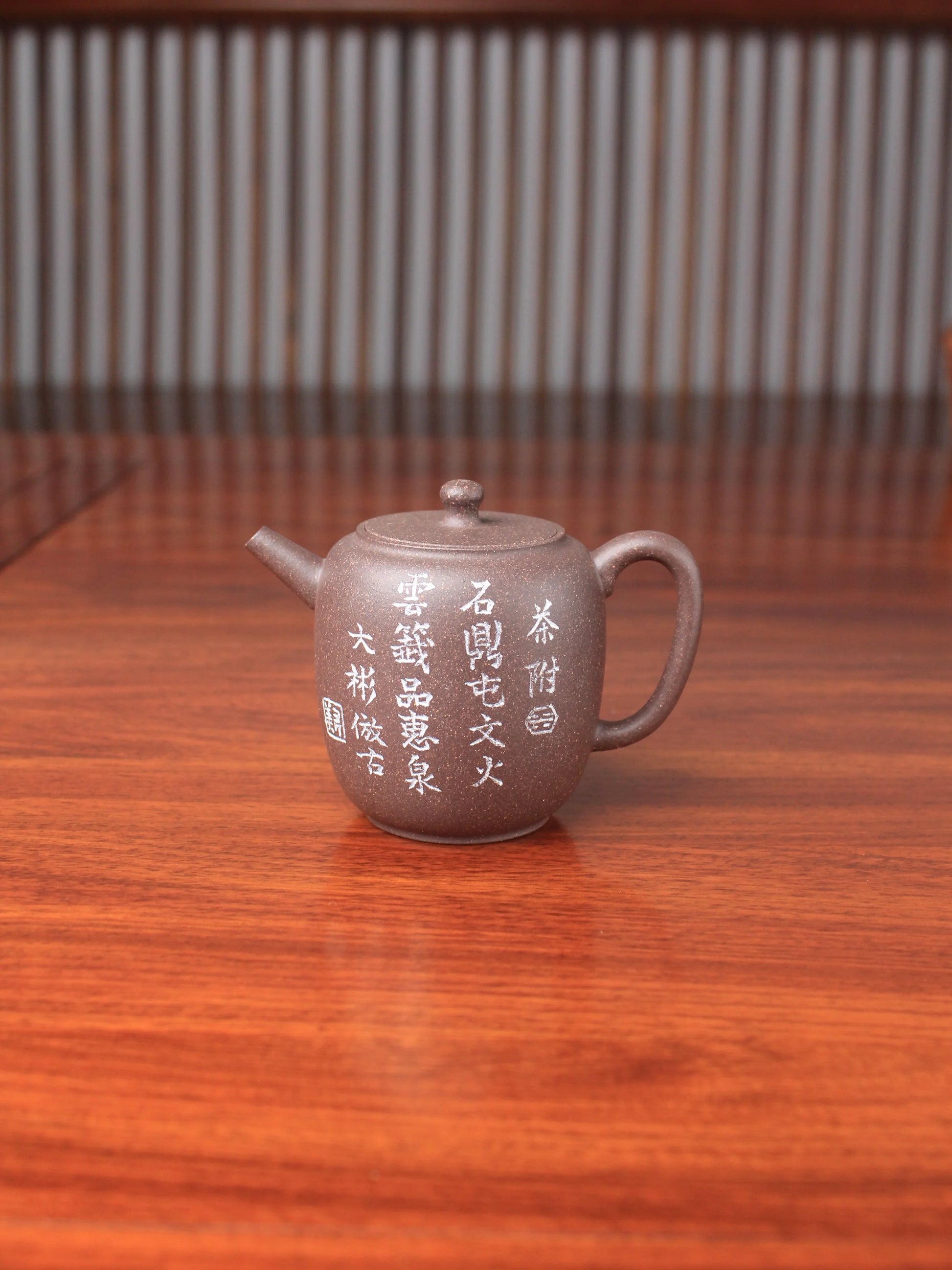 handmade yixing teapot named da bin lian zi on the table
