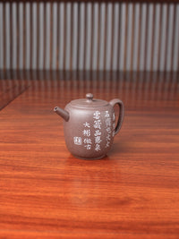 handmade yixing teapot named da bin lian zi on the table right view