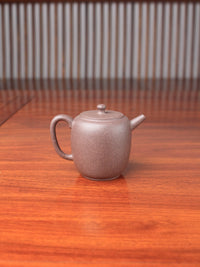 handmade yixing teapot named da bin lian zi on the table back view
