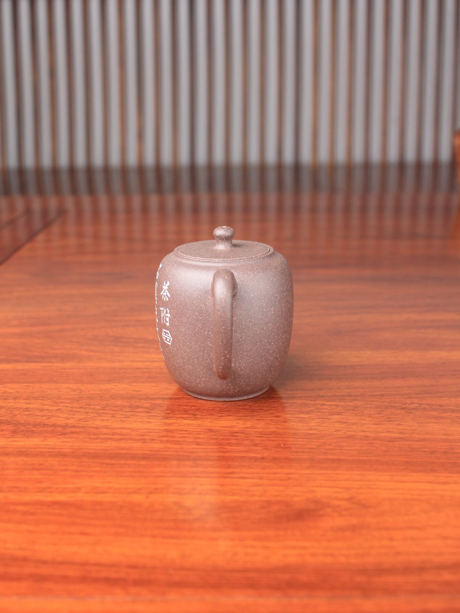 handmade yixing teapot namedda bin lian zi on the table side view
