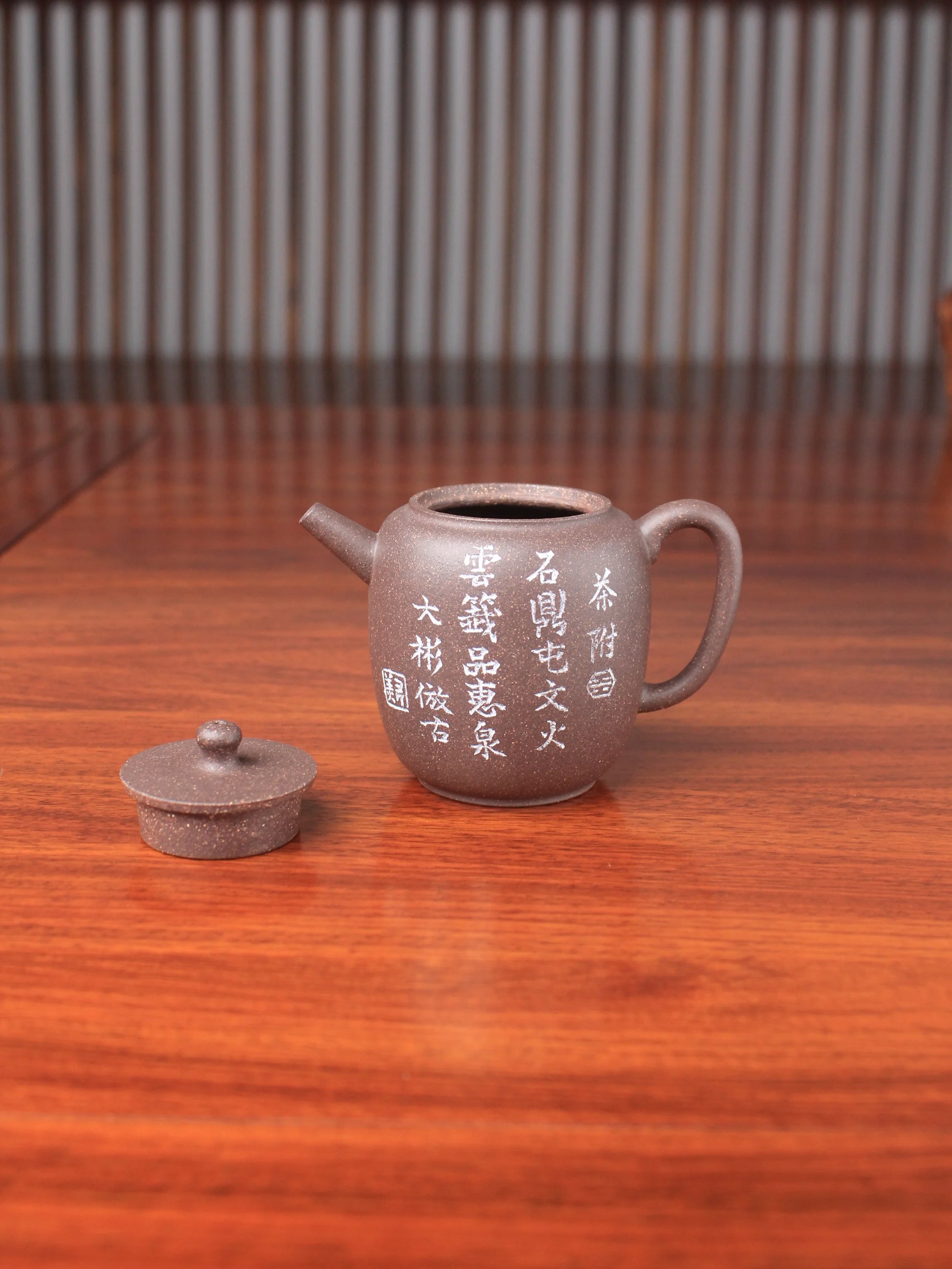 handmade yixing teapot named da bin lian zi on the table details