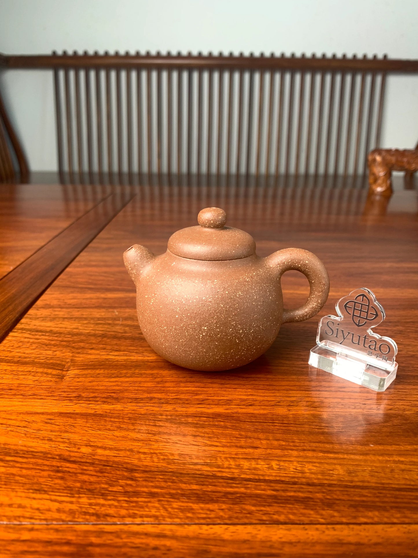 the handmade yixing teapot on the table