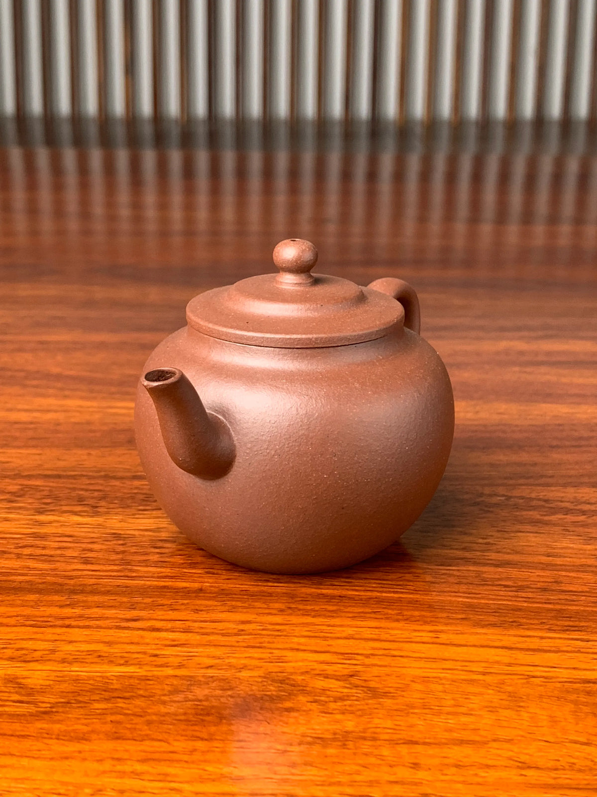 right view of handmade yixing teapot named ping gai lian zi on the table