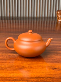 back view of handmade yixing teapot named yuan zhu 