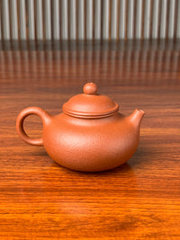 handmade yixing teapot rong tian on the table back view