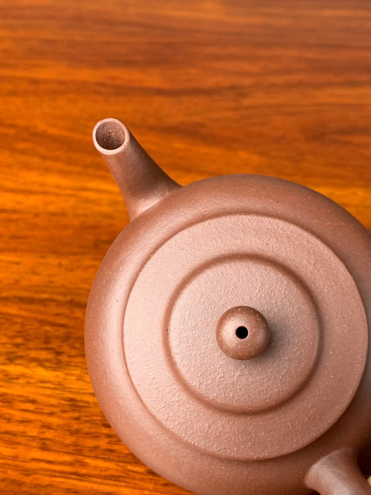 top down view of the teapot's spout and lid details