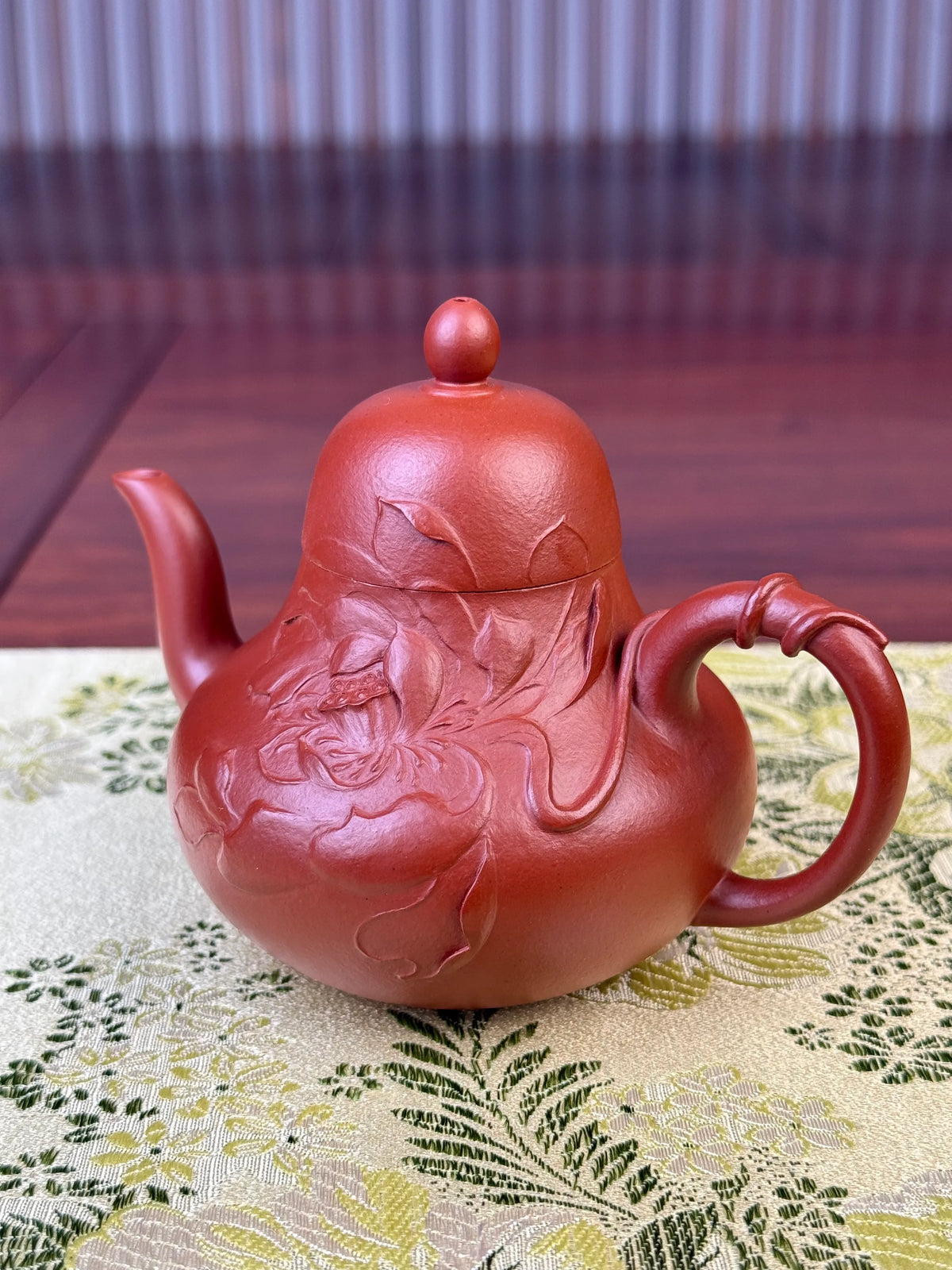 Zoom in to see the exquisite motif on this handmade zisha teapot up close