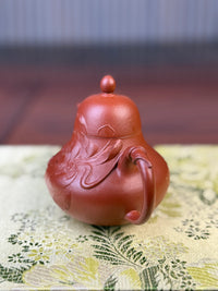 Right-side view showing the details of the lotus clay-painted motif on the teapot