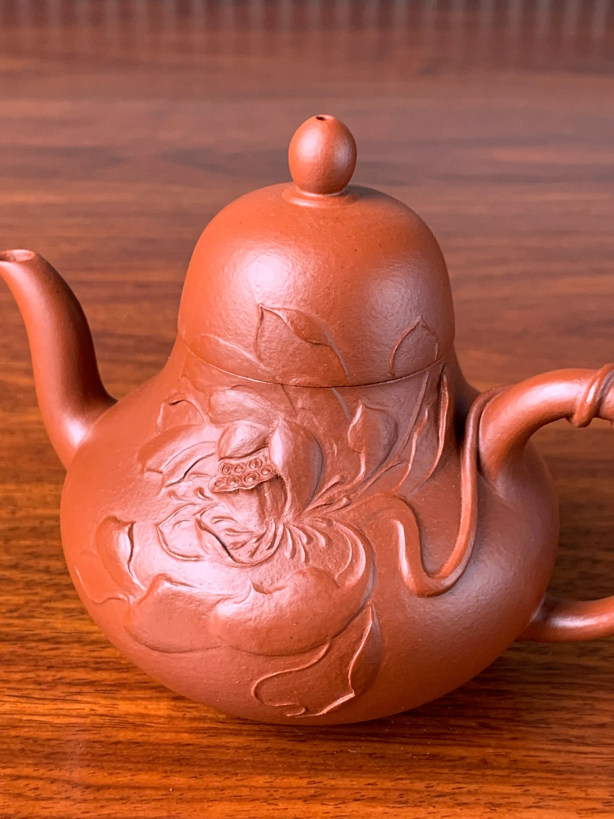 Zoom in to see the exquisite motif on this handmade zisha teapot up close