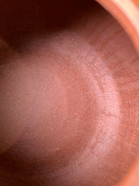 The interior tool marks and traces from the teapot's handmade process