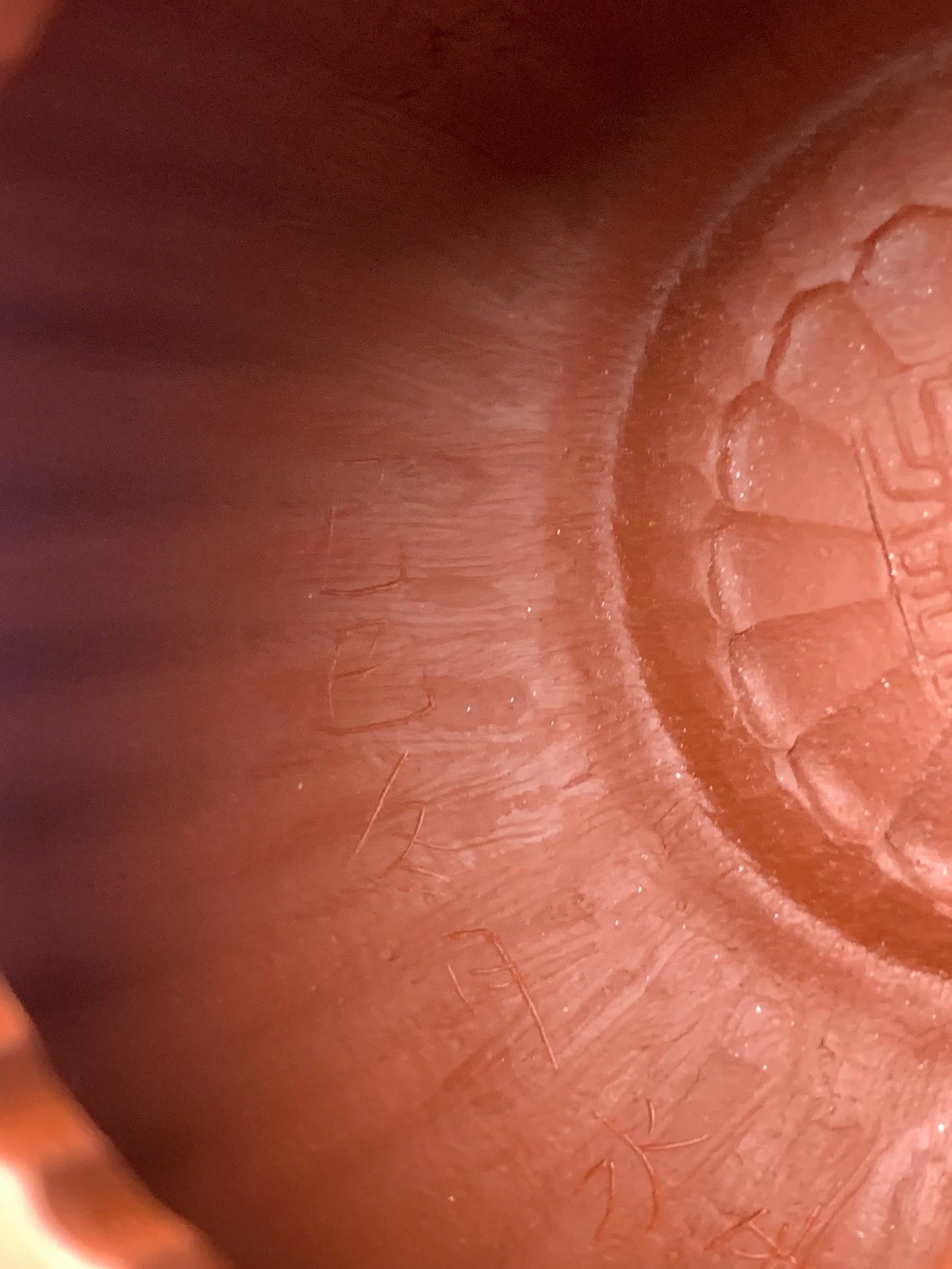 Tool marks left by handcrafting on the interior of the teapot