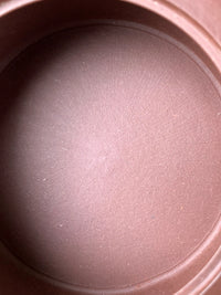 The interior tool marks left by the artisan during the fully handmade process