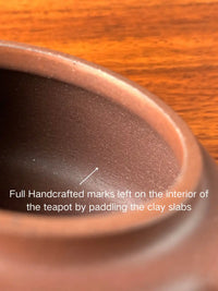 Full Handcrafted marks left on the interior of the teapot by paddling the clay slabs