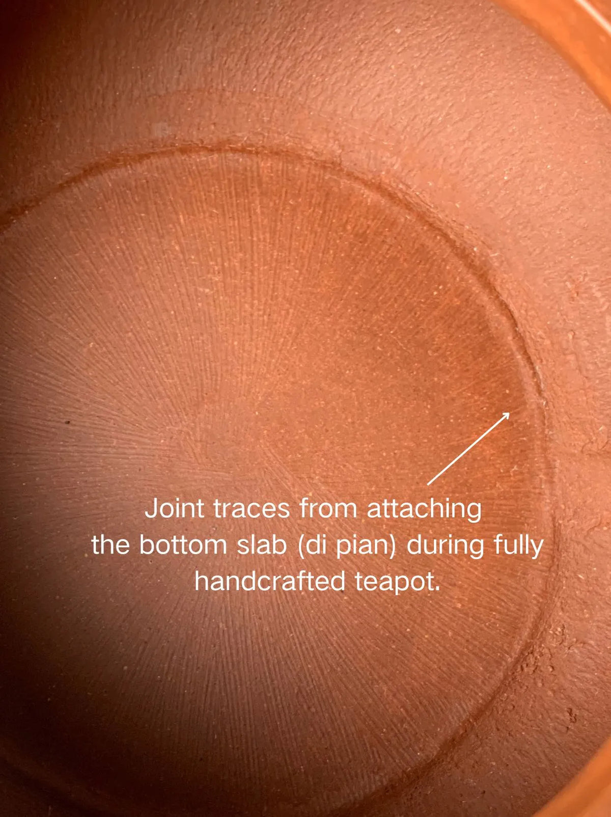 Joint traces from attaching the bottom slab (di pian) during fully handcrafted teapot.