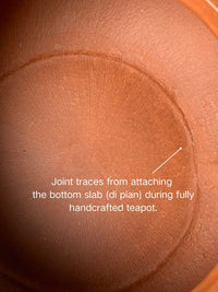 Joint traces from attaching the bottom slab (di pian) during fully handcrafted teapot.