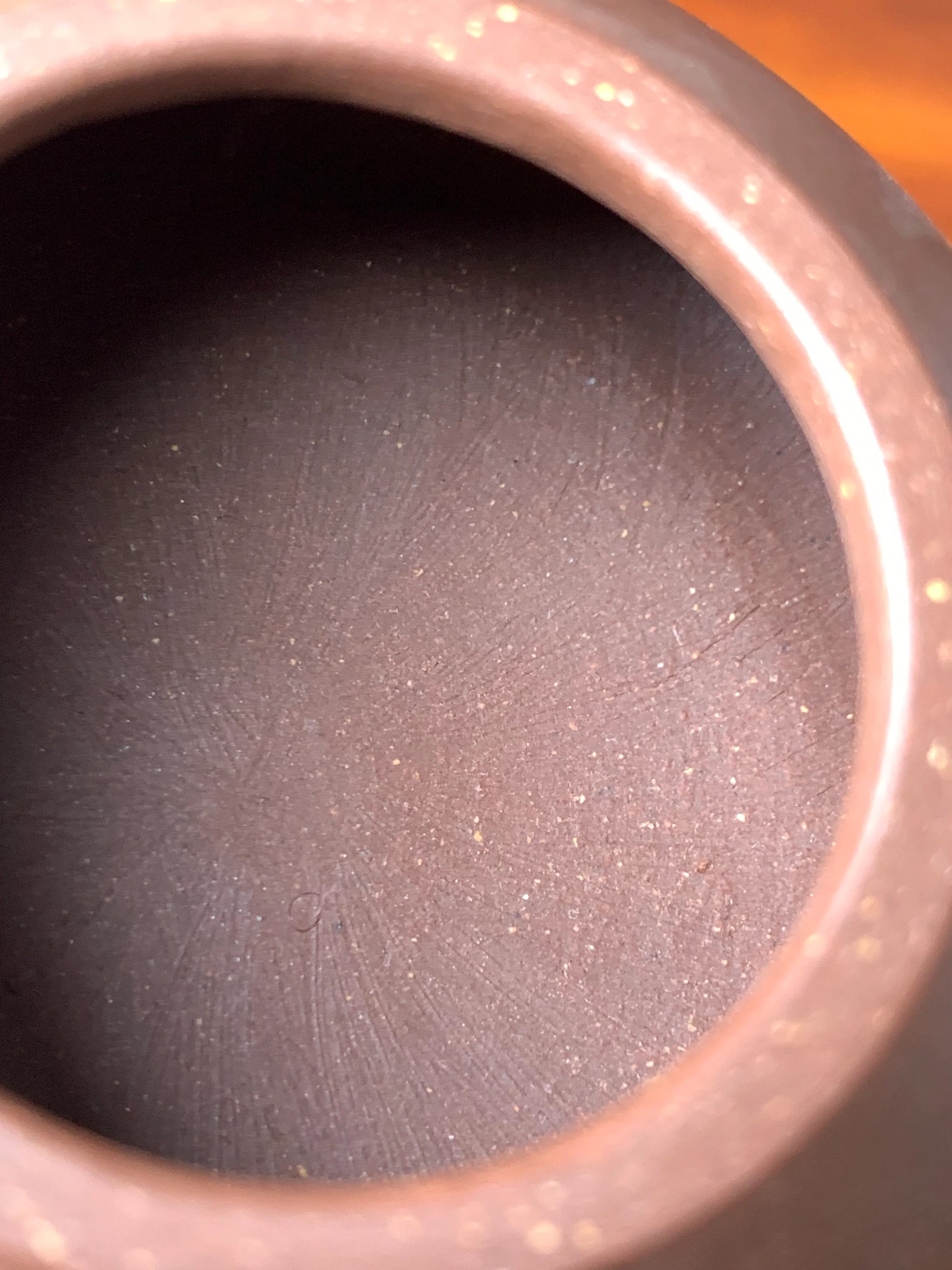 The tool marks left on the interior of the fully handmade teapot