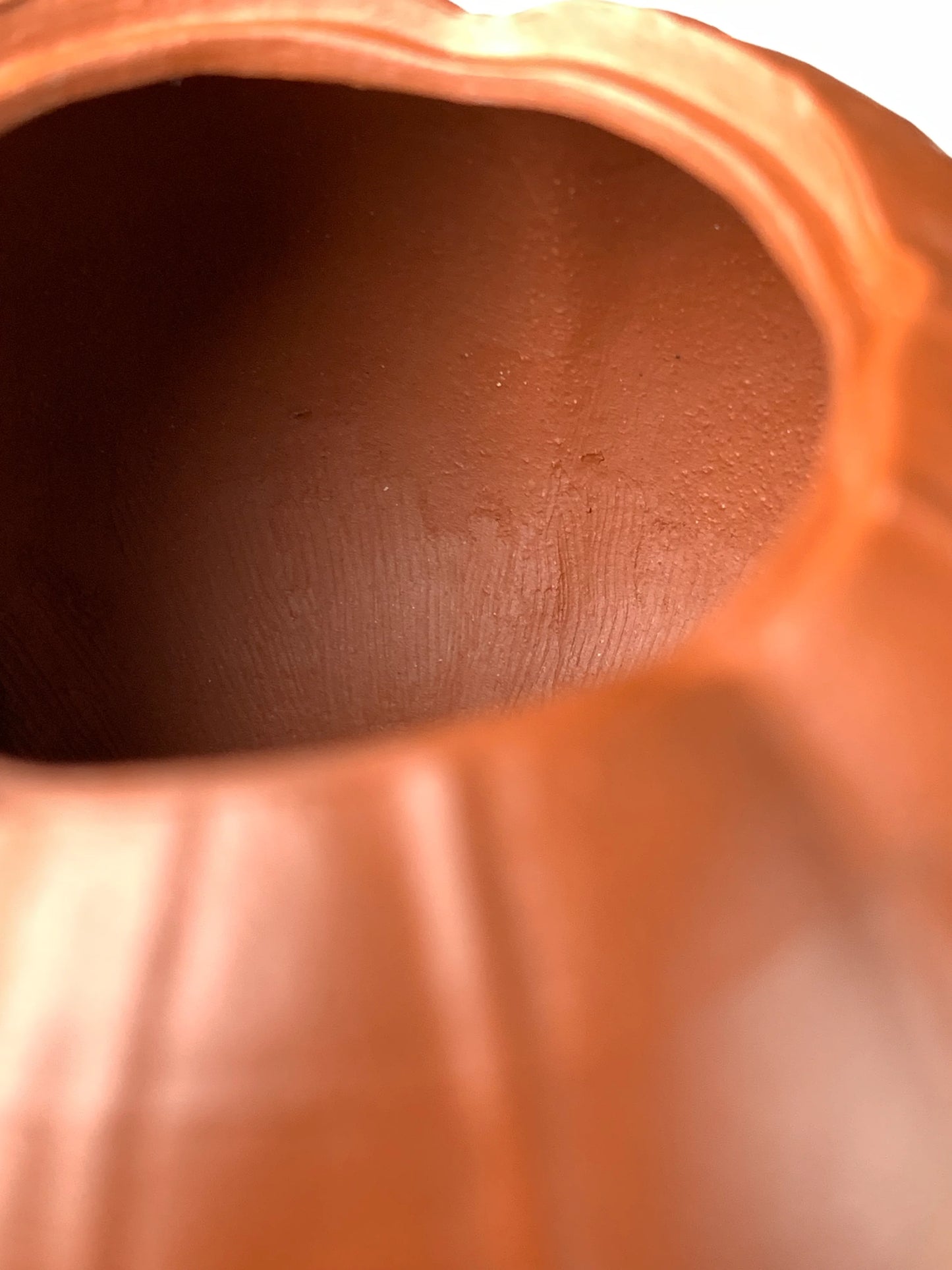 Close up photo of marks left by hand tools inside the teapot