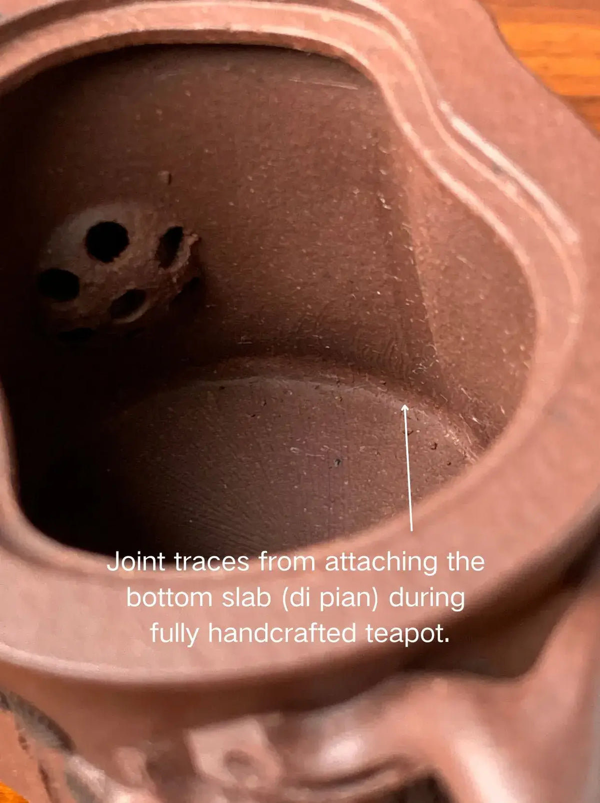 Joint traces from attaching the bottom slab (di pian) during fully handcrafted teapot.